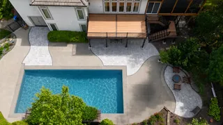 Composite deck with stairs next to pool