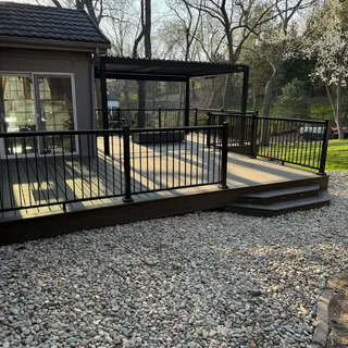 Custom composite deck and outdoor living space built by Willow Outdoor